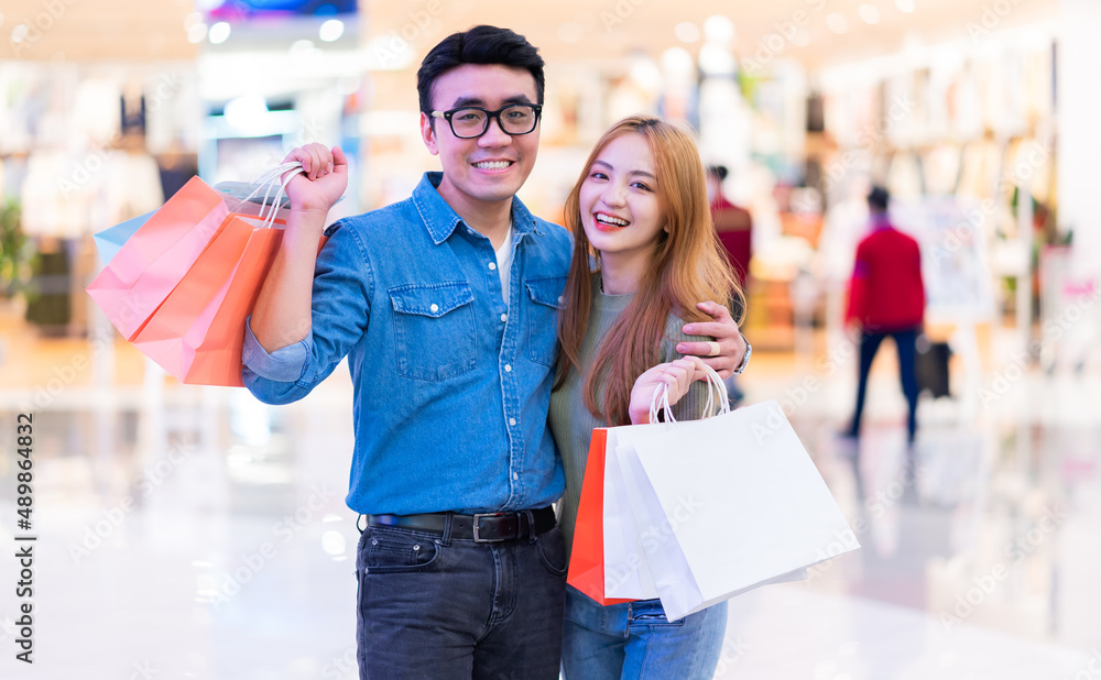 Asian couple shopping at the mall