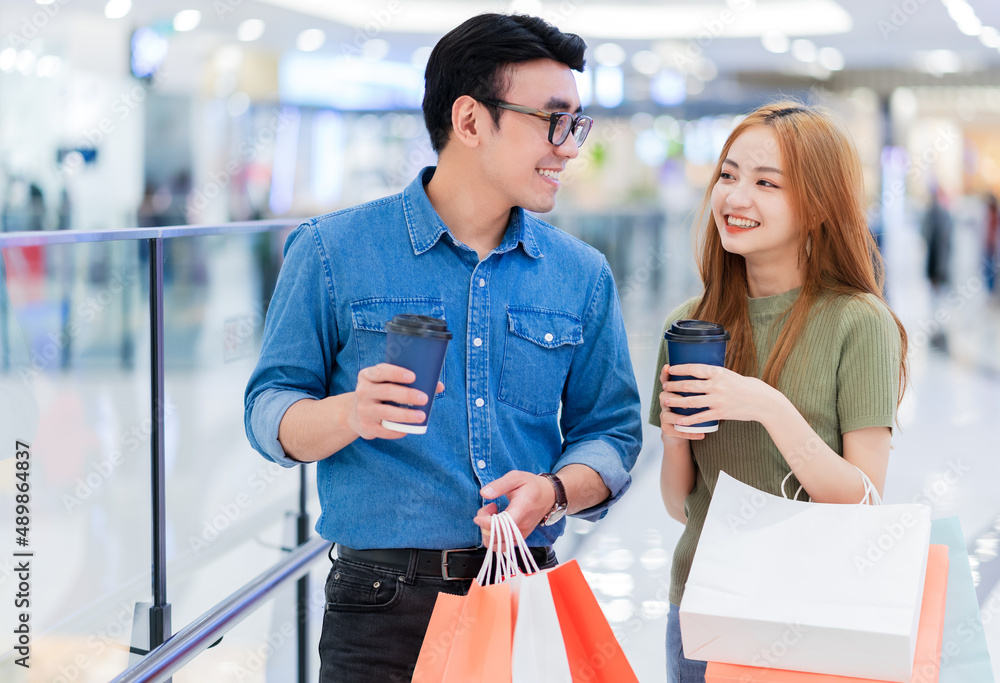 Asian couple shopping at the mall