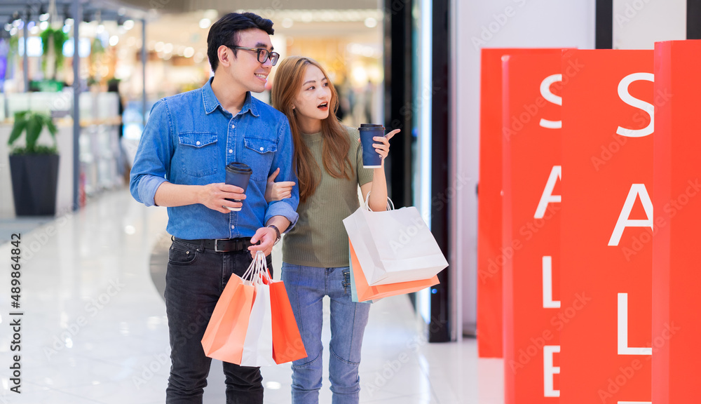 Asian couple shopping at the mall