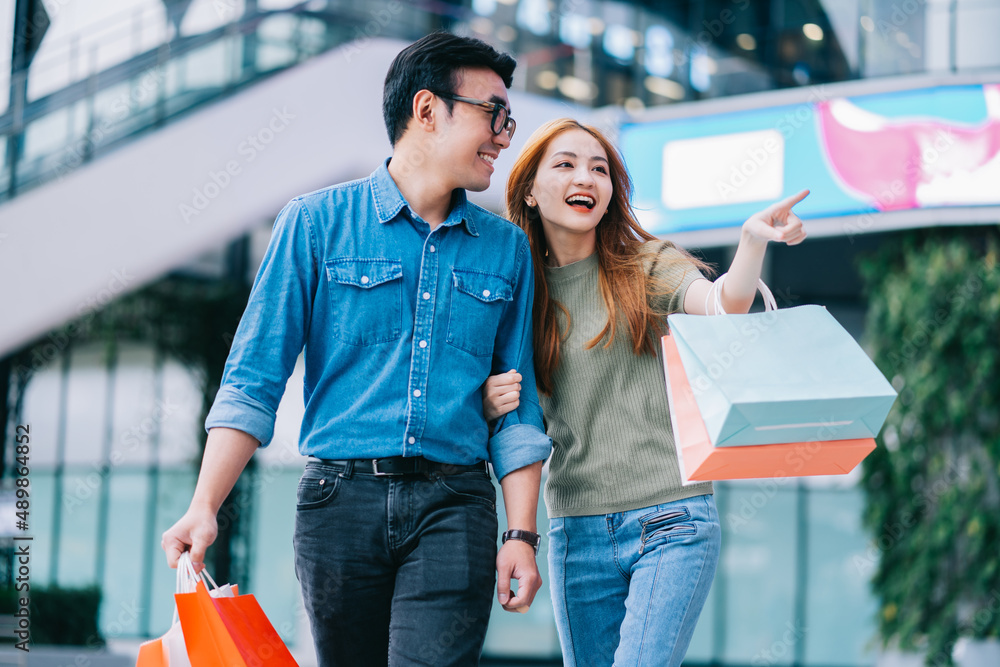 Asian couple shopping at the mall