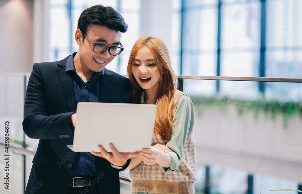 Portrait of young Asian business people at office