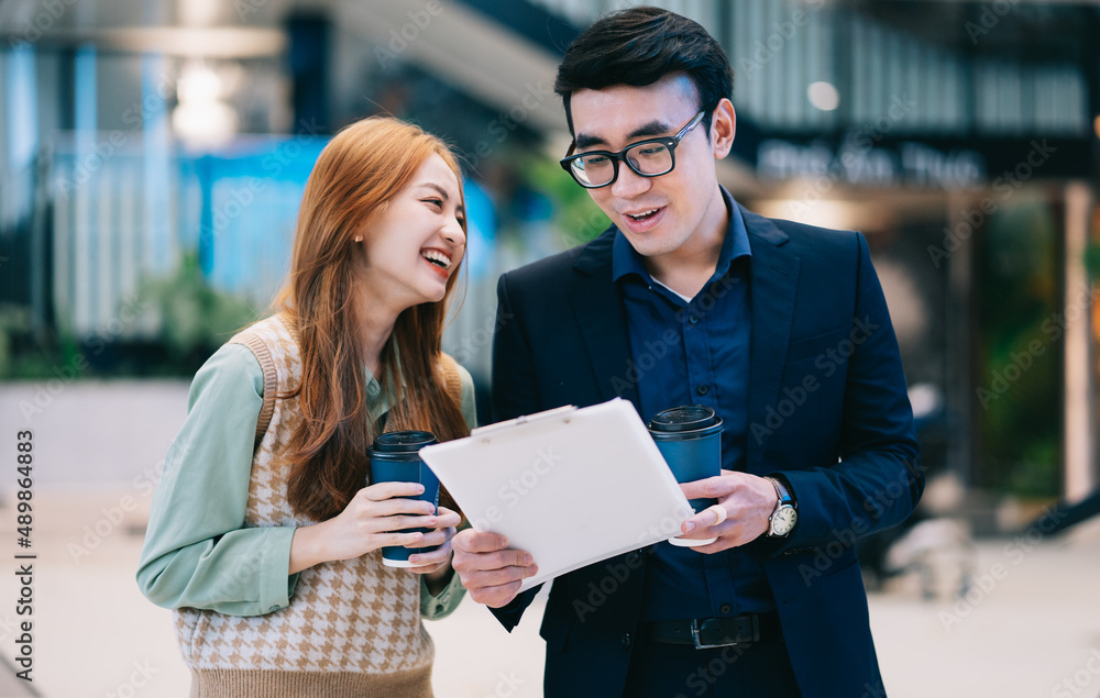 Portrait of young Asian business people at office