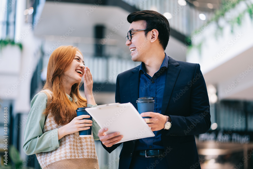 Portrait of young Asian business people at office