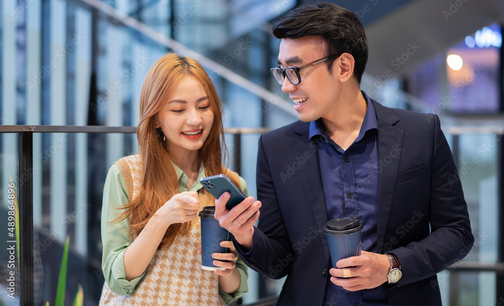 Portrait of young Asian business people at office