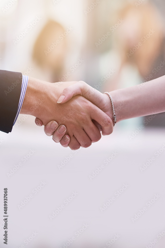 Pleasure doing business with you. Shot of two businesspeople shaking hands.