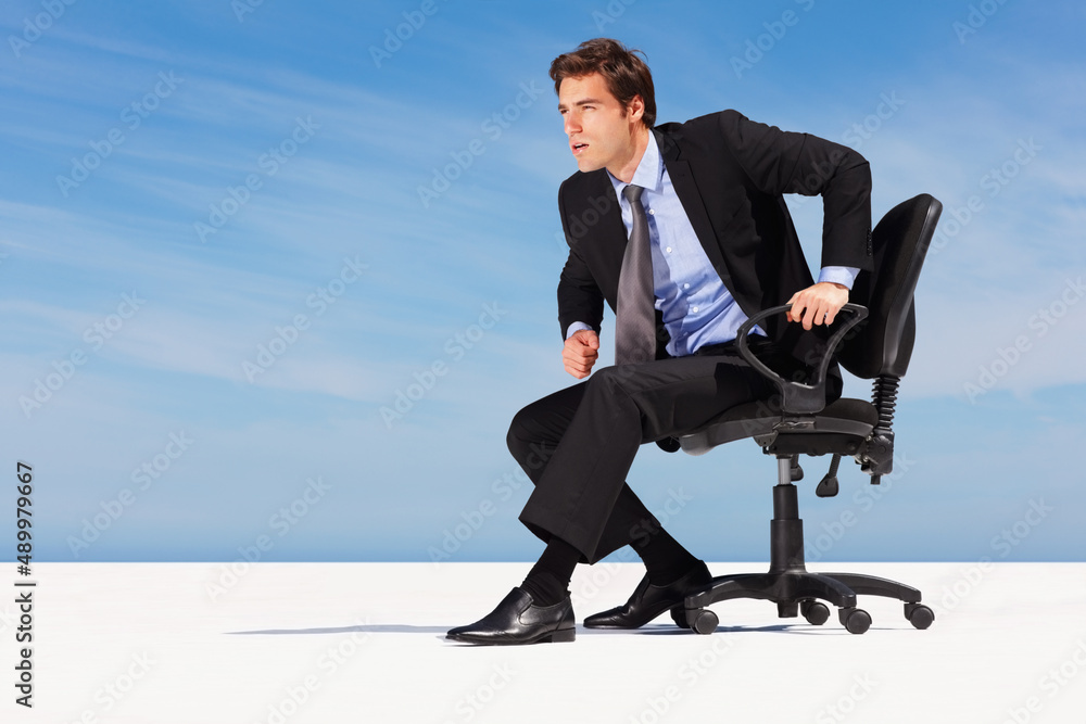 Business man getting ready to walking towards success. Young business man on chair and getting ready