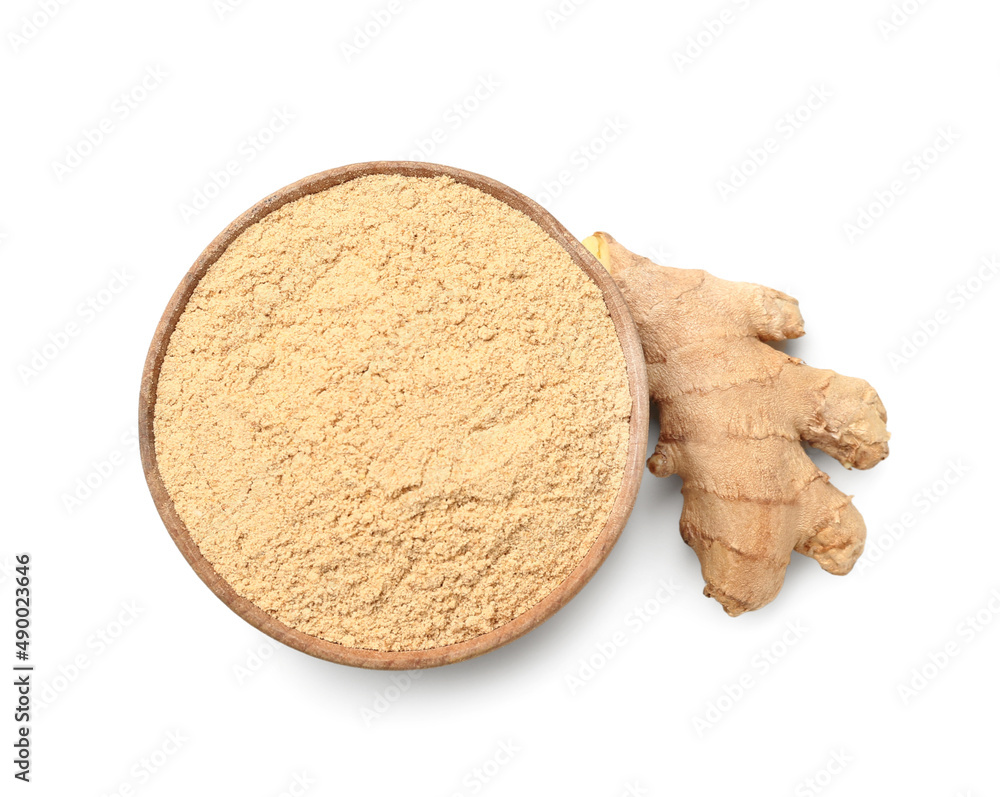 Bowl of ginger powder and root isolated on white background