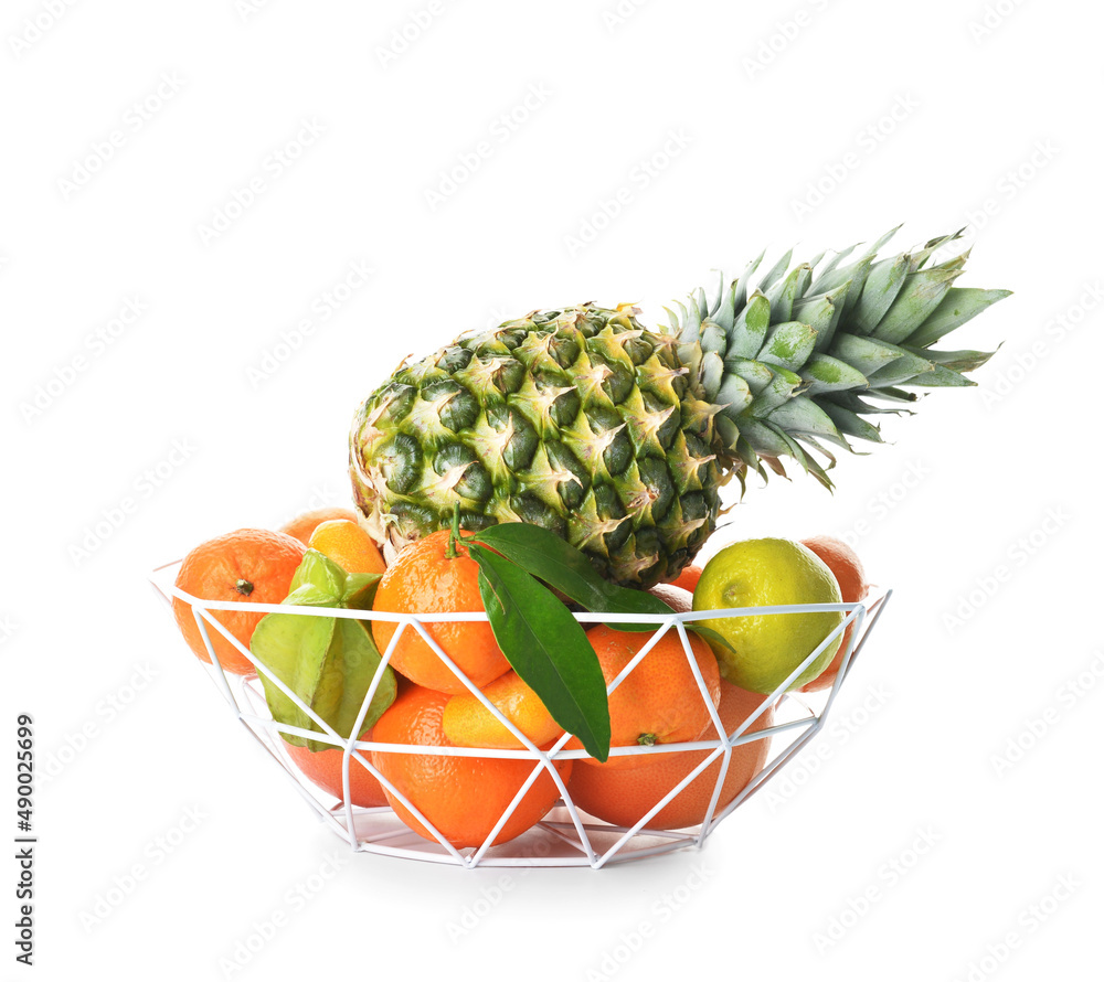 Basket with juicy fruits on white background