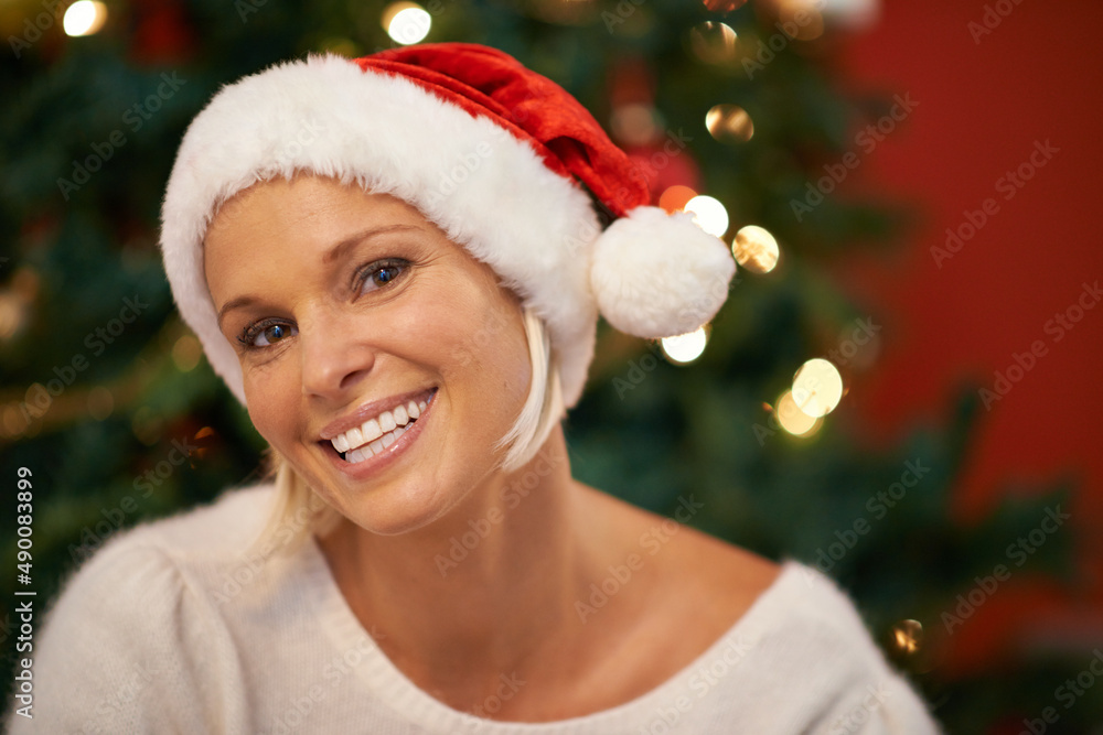 Big smile for santa. Portrait of a cheerful woman wearing a christmas hat.