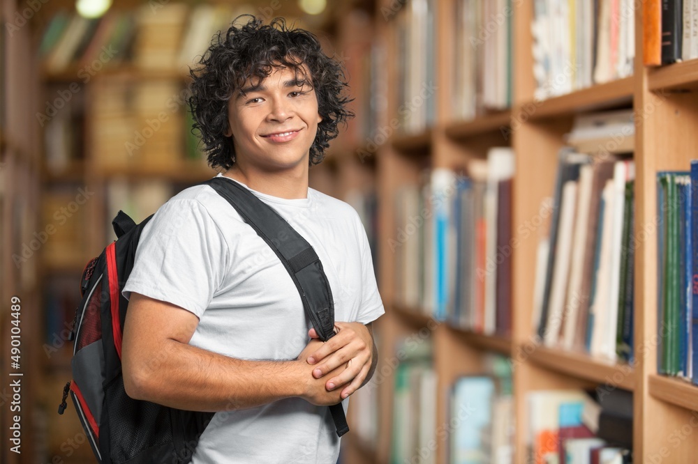 Happy young student at the university background