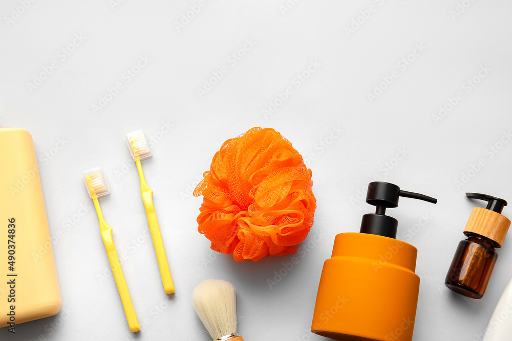 Set of cosmetic products and bath accessories on white background