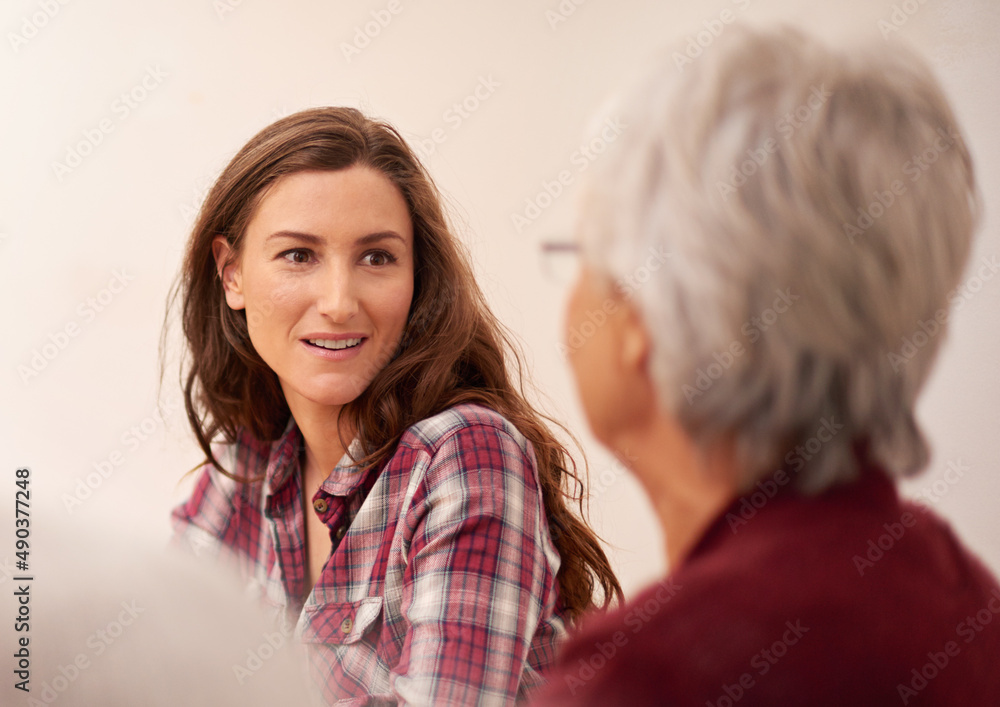 She admires her mother. Shot of an attractive woman bonding with her senior mother at home.