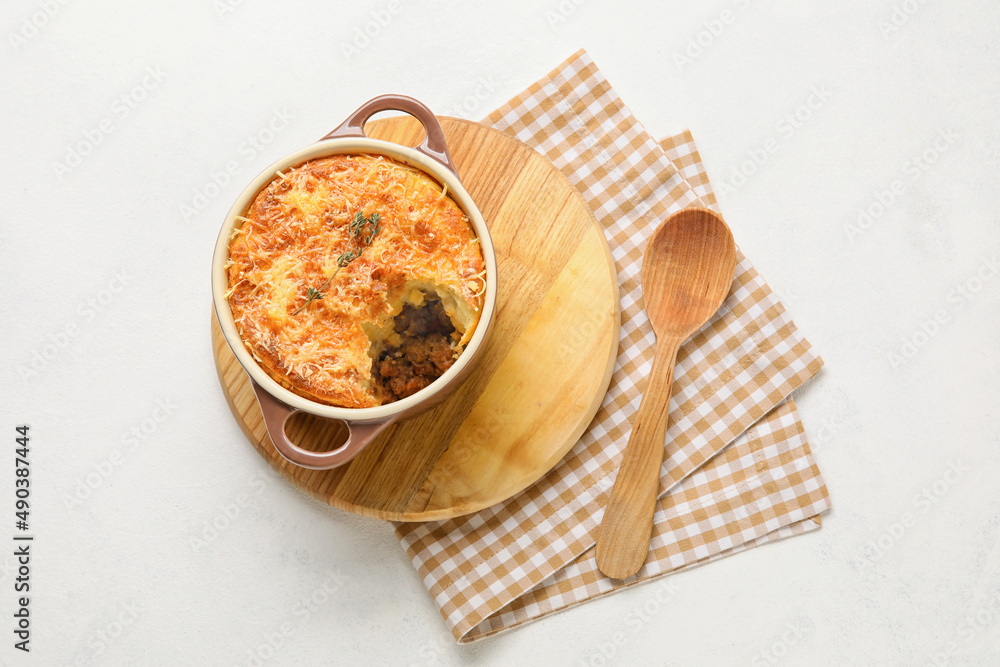 Pot with tasty Shepherds pie on white background