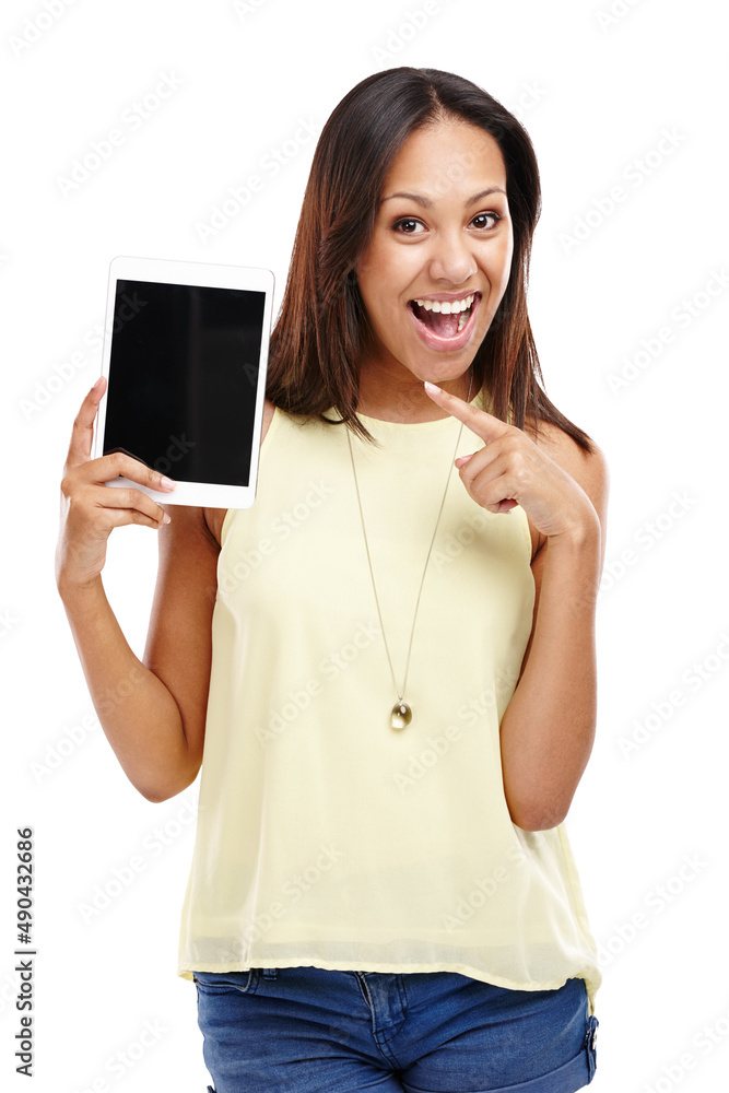 Youre never alone with a tablet in your hand. Portrait of an attractive young woman pointing at the 