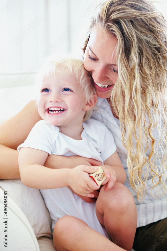 There is no love like a mothers love for her child. Shot of a mother and her baby boy playing with b