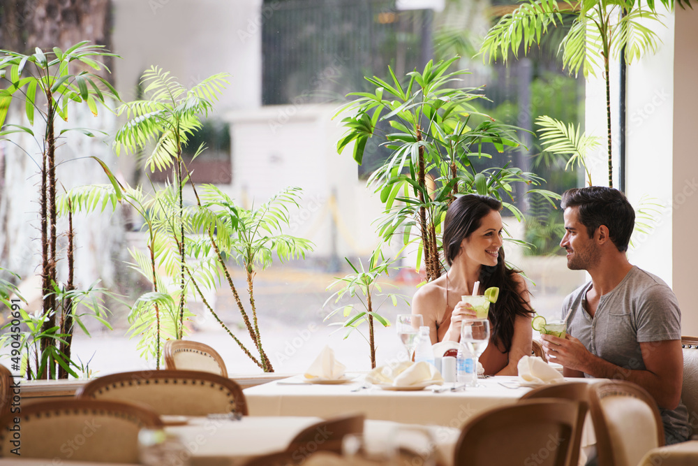 Table for two. A couple on a romantic date at a fine dining restaurant.