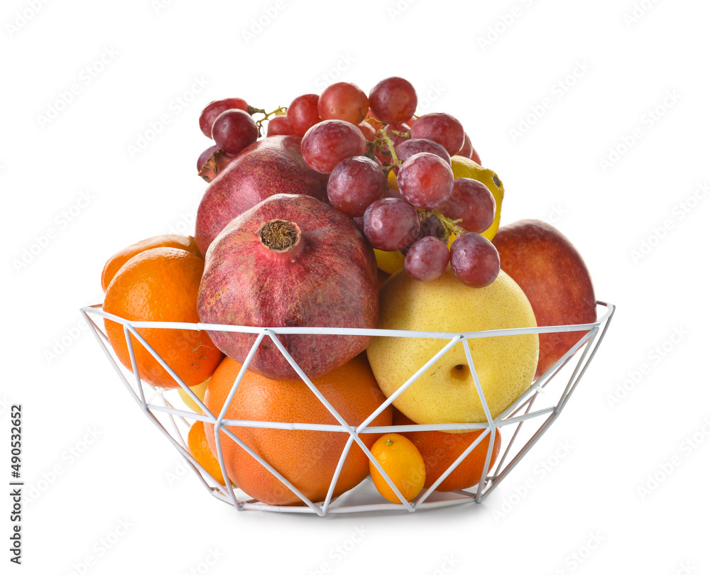 Basket with juicy fruits on white background