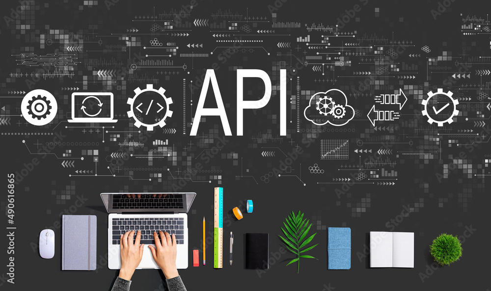 API - application programming interface concept with person using a laptop computer