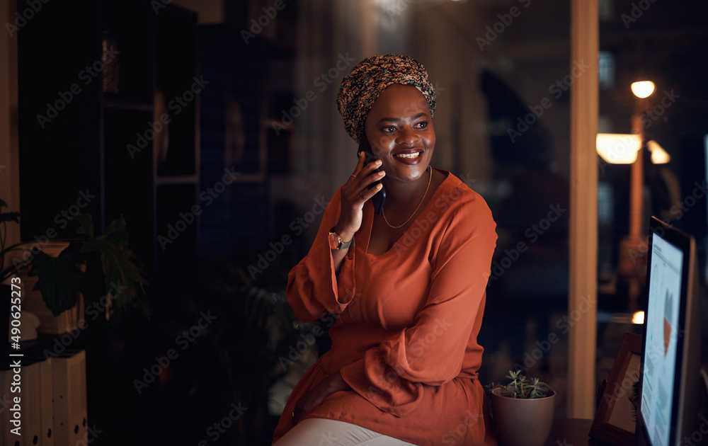 I got the deadline done and will be home soon. Shot of a young businesswoman talking on a cellphone 