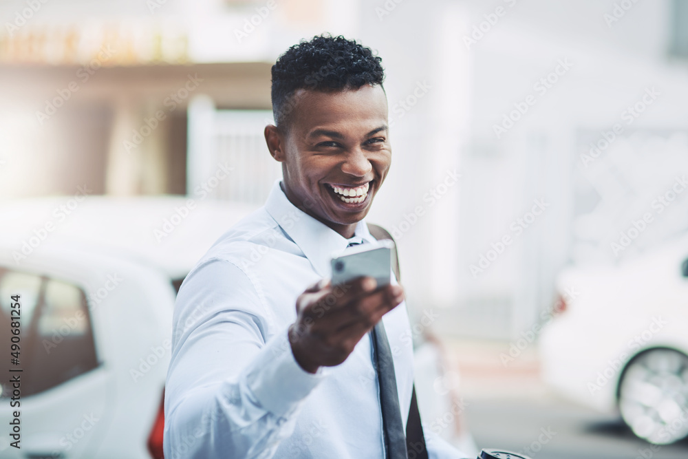 Be sure to save my number so we can do business. Portrait of a handsome young businessman using a ce