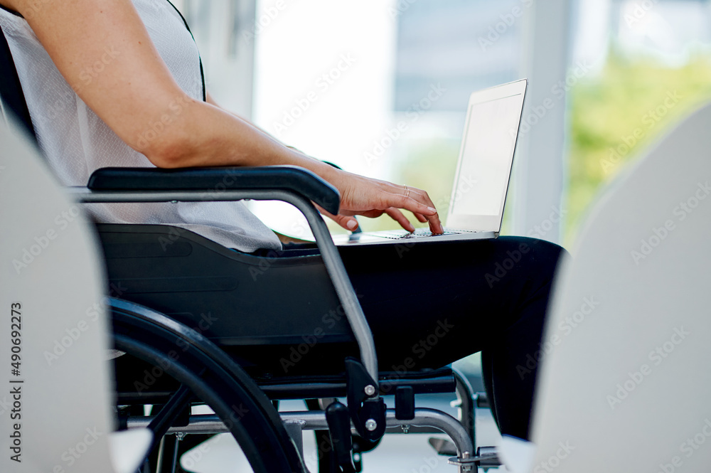 I have a disability but that wont stop me. Cropped shot of an unrecognizable businesswoman using her