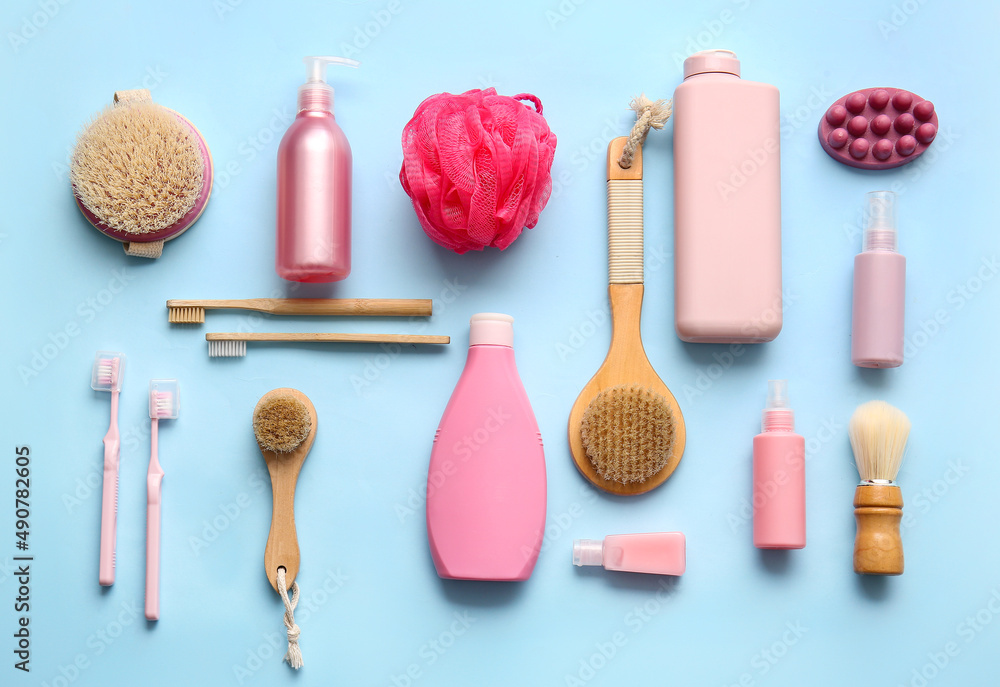 Composition with bath accessories and cosmetic products on color background