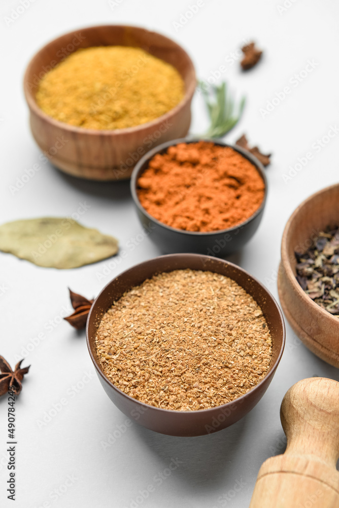 Bowls with aromatic spices isolated on white background, closeup