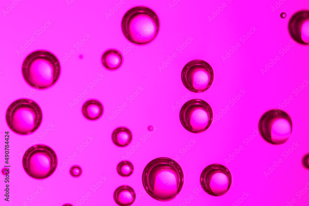 Clear water with bubbles on color background, closeup