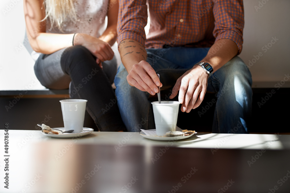 They love their coffee. Cropped image of a young couple enjoying coffee at their local cafe.