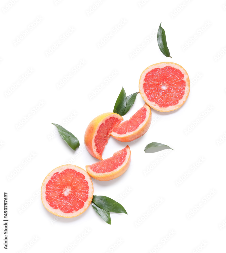 Fresh grapefruit pieces on white background