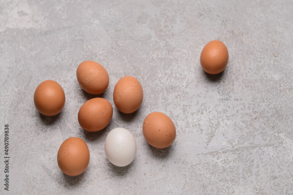 Natural chicken eggs on grey background