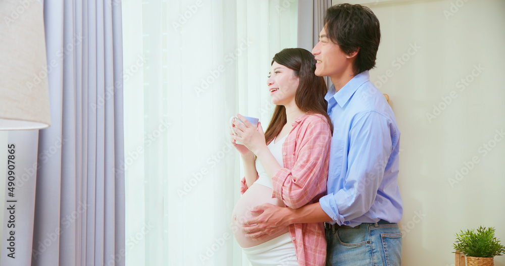 asian pregnant couple feel love