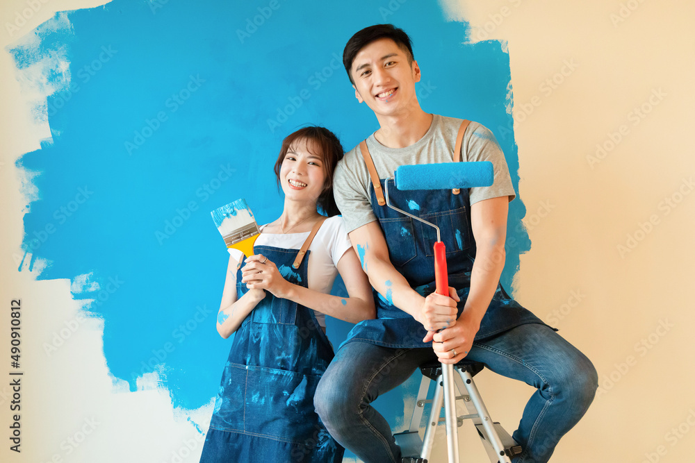 couple painting wall