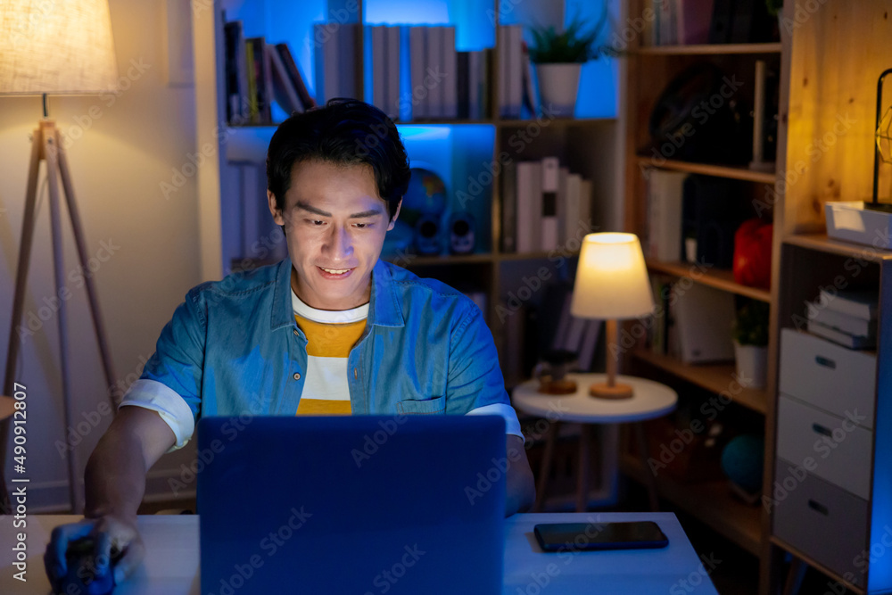 man using laptop at home