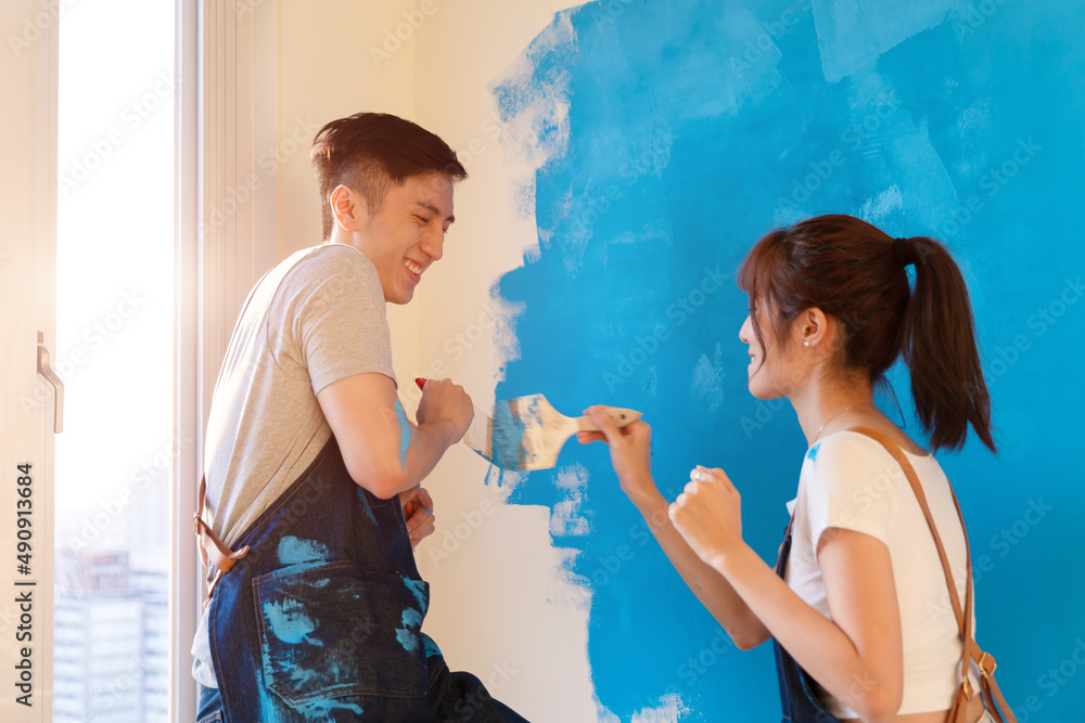 couple painting wall