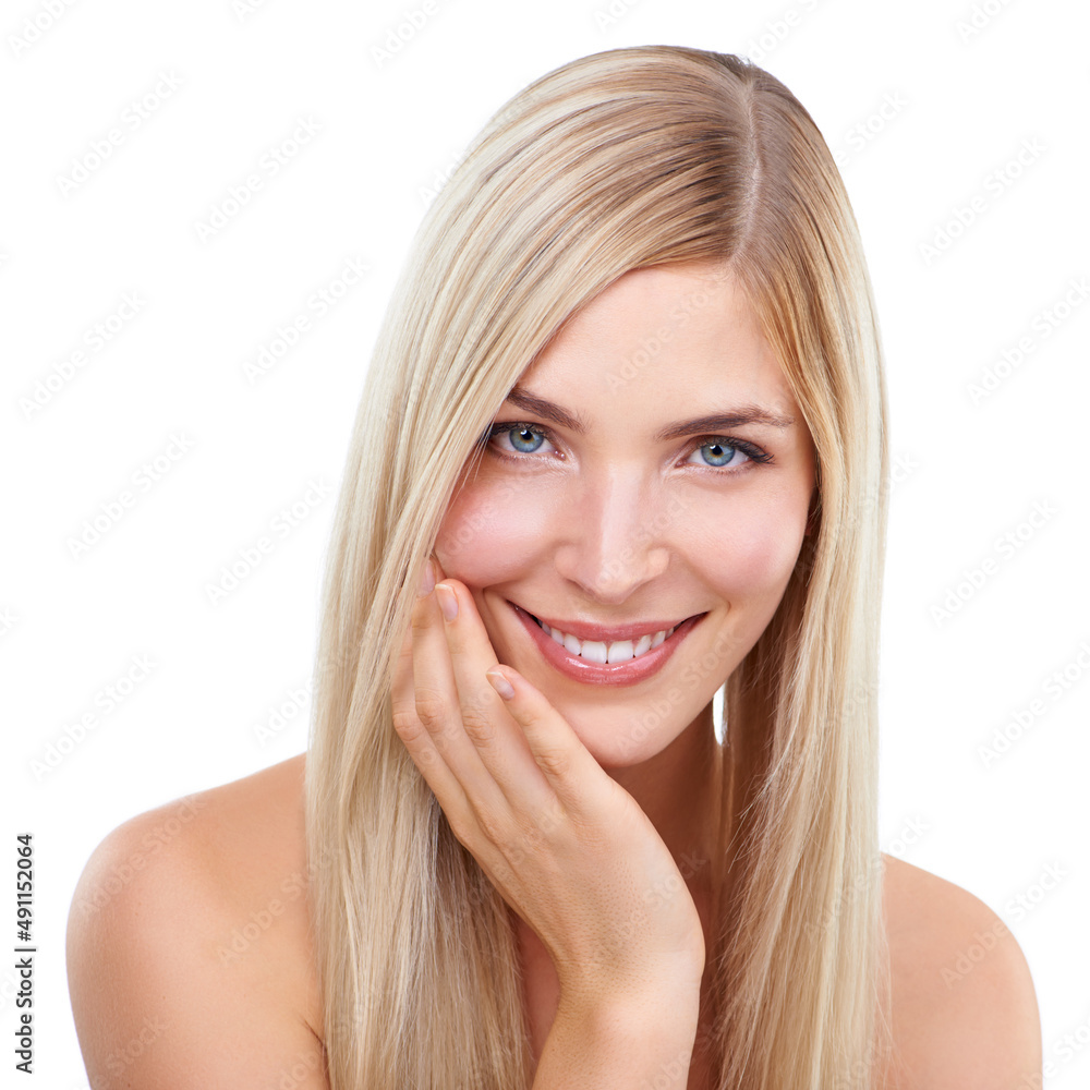 Her beauty is more than skin deep. A stunning young blonde woman posing against a white background.