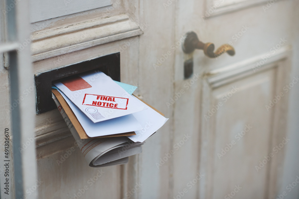 This is your final notice. Cropped shot of letters in a letter box.