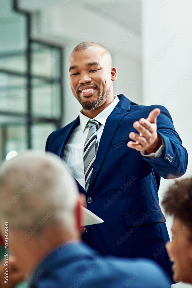 Lets hear what our next speaker has to say. Cropped shot of a businessman introducing his colleague 