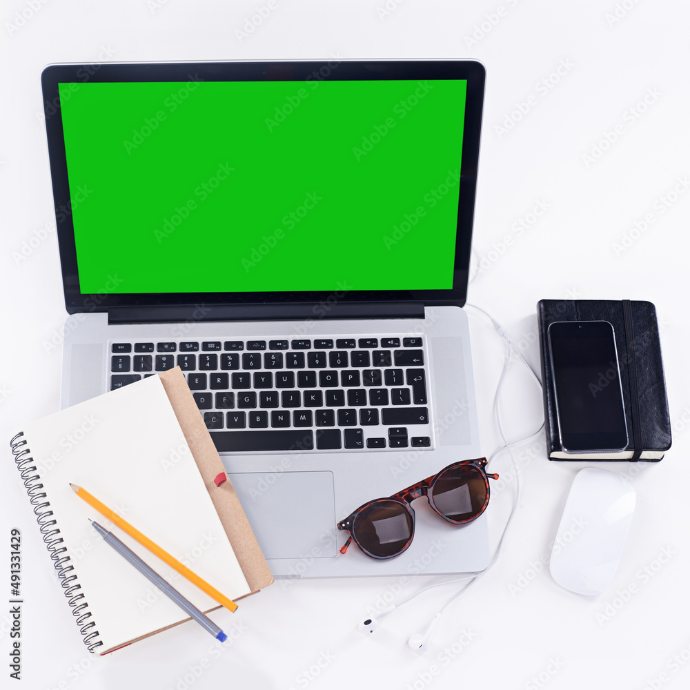 With the right tools, everyday can be a productive one. Shot of a laptop, glasses, mouse and noteboo