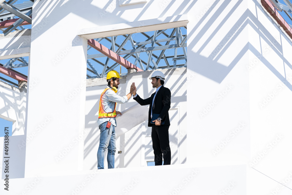 Businessman and architect shake hand success at construction site,Partnership,Teamwork,Community,Con