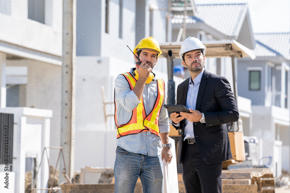 Architect and engineer foreman discussion for plans for new home and working on a building site,Home