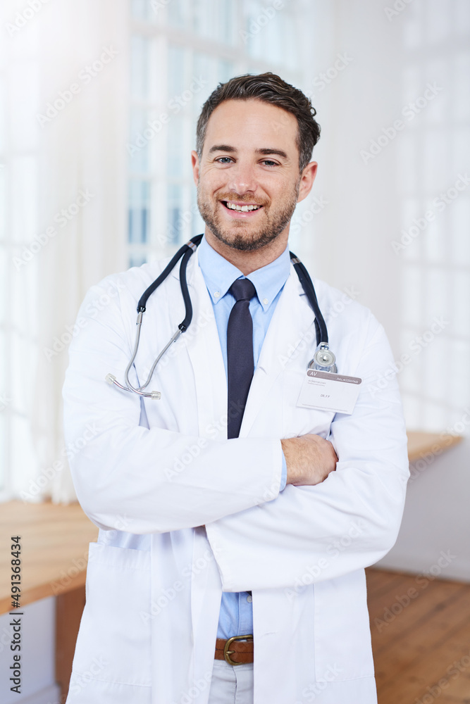 Lets get you better asap. Portrait of a confident young doctor standing in his consulting room.