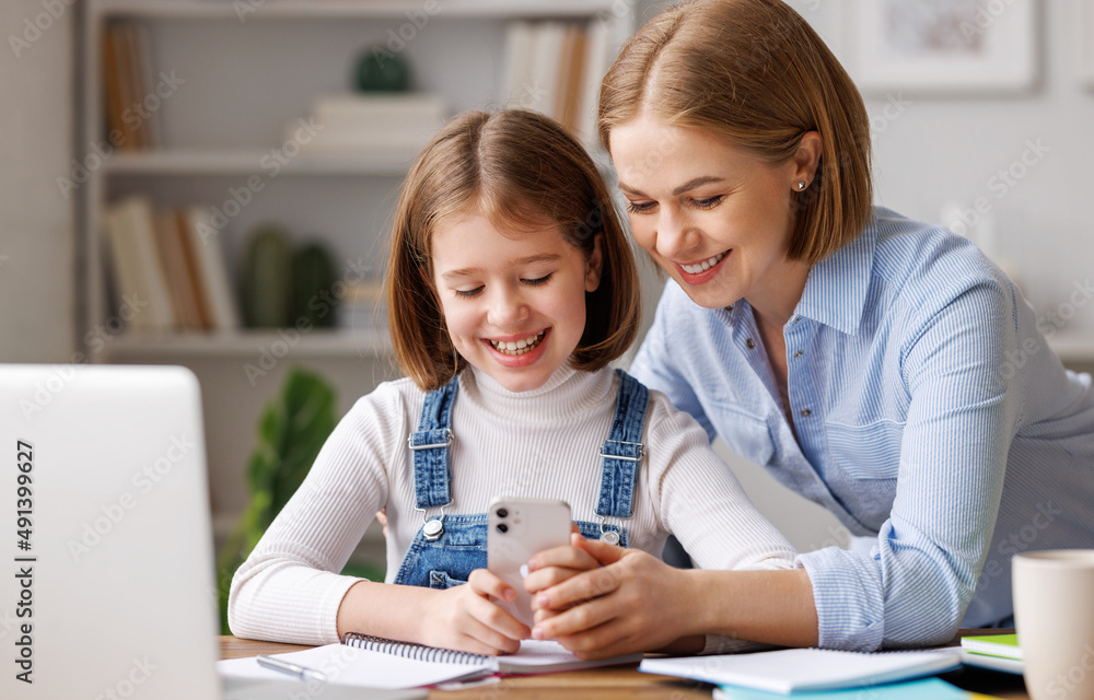 Mother and daughter doing homework together