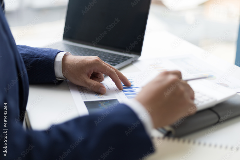 Bankers are calculating financial accounts with calculators and checking accounts.