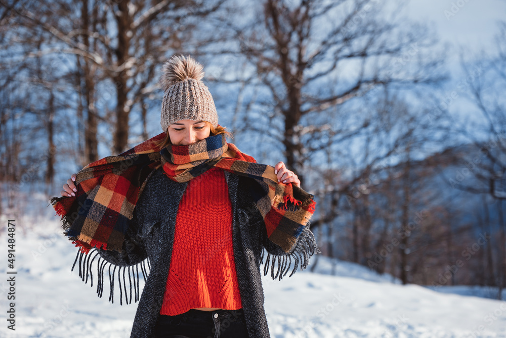 Happy girl in winter clothes portrait snowy outdoor during sunny day