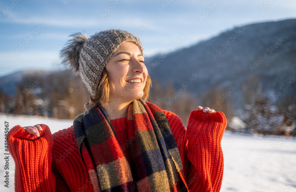 Happy winter time cheerful woman having fun outdoor