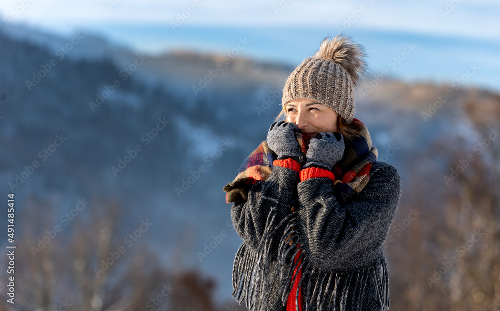 Winter portrait outdoor beautiful woman wearing woolen sweater hat and scarf