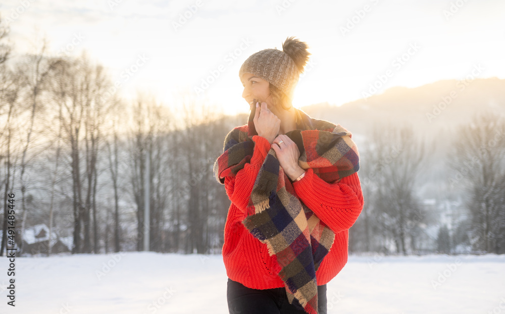 Winter portrait outdoor beautiful woman wearing woolen sweater hat and scarf