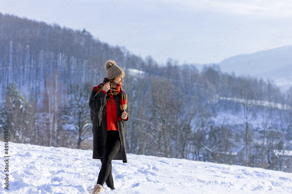 Winter portrait outdoor beautiful woman wearing woolen sweater hat and scarf