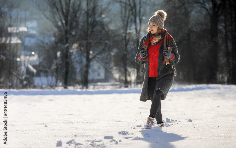 Winter portrait outdoor beautiful woman wearing woolen sweater hat and scarf